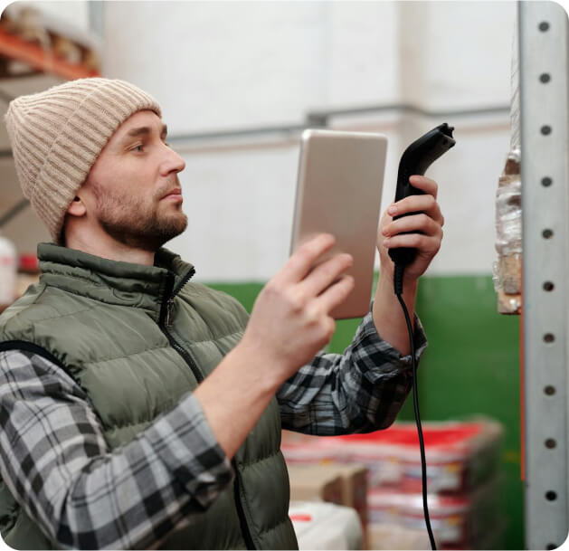 person scanning items with a tablet and scanner