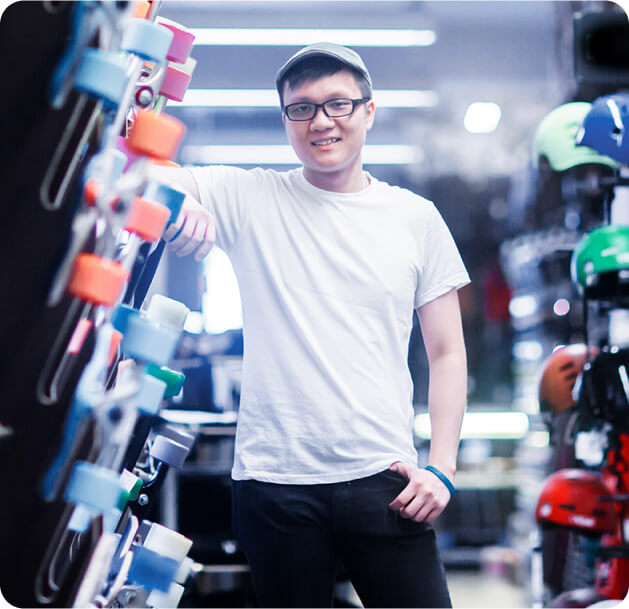 man standing in surf and skate shop